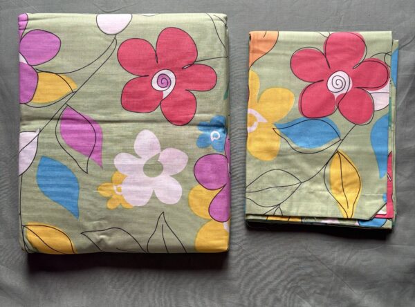Colorful floral print cotton bedsheet set in sage green with matching floral pillow covers
